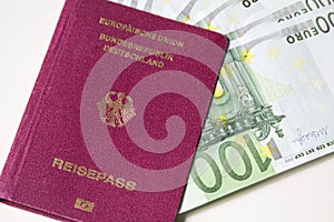 German international traveling passport and euro money.