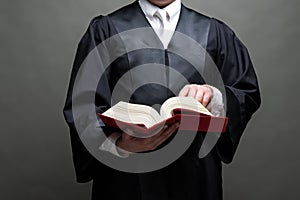 German lawyer with a robe and a book