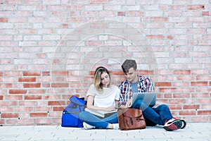 German male and female student with copy space