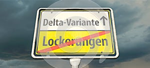 German place-name sign with the Germans words `Lockerungen` and `Delta-Variante` `Easing` and `Delta variant`