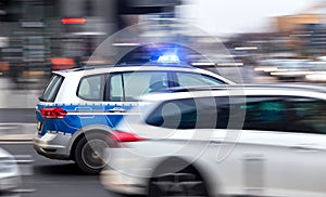 German police car speeding in city traffic