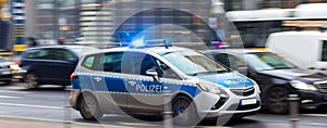 German police car speeding in city traffic