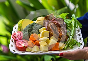 German pork knuckle and colorful vegetables.