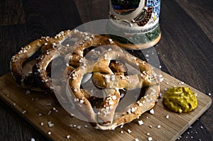 German Pretzels Snacks Beer Stein and Mustard on Wood