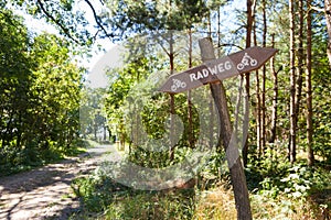 German Radweg, cycleway sign in a forest photo