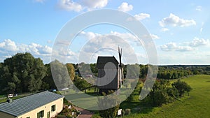 German residential house with own windmill. Perfect aerial view flight