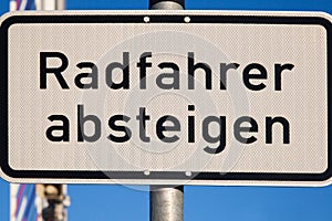 German road sign for cyclists to dismount their bike