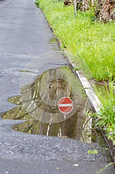 German road sign for one way and forbidden direction as restriction and prohibition for cars and road traffic as nice reflection