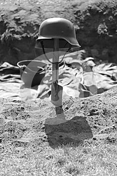 German second world war II helmet on a shovel
