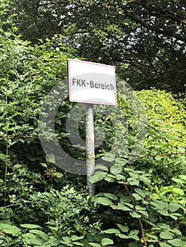 German sign FKK Bereich translates as nudist area - nudism or naturism in Germany photo