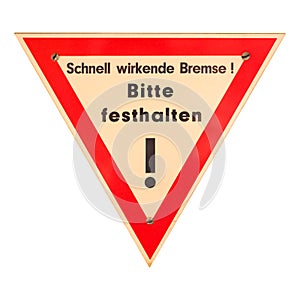 German sign isolated over white. Fast acting brake, please hold