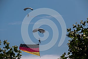 German skydiver in the air with German flag