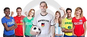 German soccer supporter with ball and fans from other countries