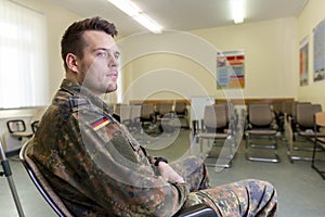 German soldier stands in a classroom