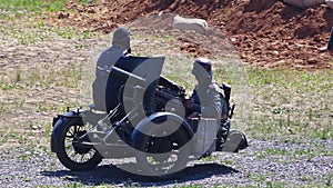 German soldiers with a machine gun Maxim, mounted on a motorcycle