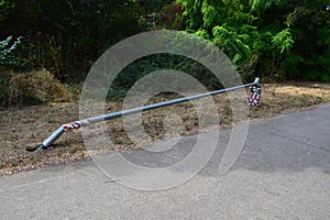 fallen lamp post on the roadside
