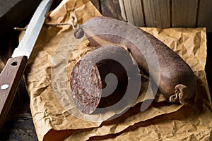 German specialty blood sausage Blutwurst on wooden table