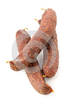 German specialty salami hard cured sausage whole over white