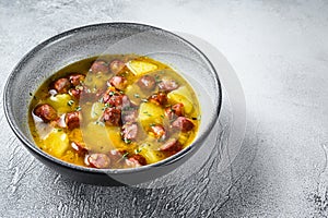 German Split pea soup with smoked sausages. White background. Top view. Copy space