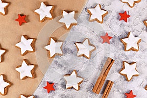 German star shaped glazed Christmas cookies called `Zimtsterne` made with amonds, egg white, sugar, cinnamon