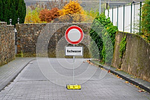 A german street sign forbidding entry due to flooding