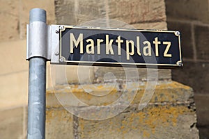 German street sign `Marktplatz` translates into market place photo