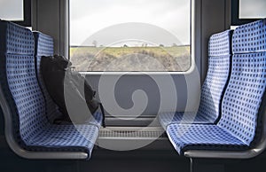 German train interior and rucksack on chairs