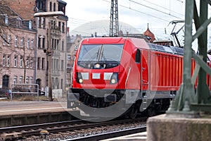 German train passes a train station