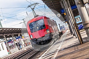 German train passes a train station