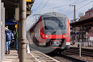 German train passes a train station