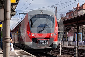 German train passes a train station