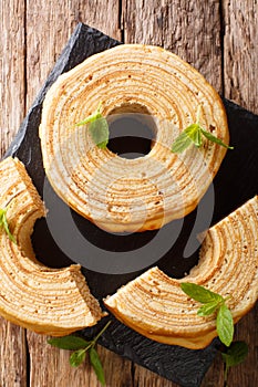 German for tree cake, Baumkuchen is sometimes also known as pyramid cake, or spit cake close-up. Vertical top view