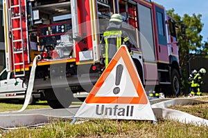German Unfall accident sign near a fire truck photo