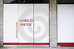 German vacancy sign on storefront - Laden zu mieten means store to let