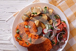 German Weiner schnitzel with potatoes closeup. horizontal top vi