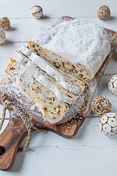 German whole christmas Stollen or Christstollen on white background with decoration