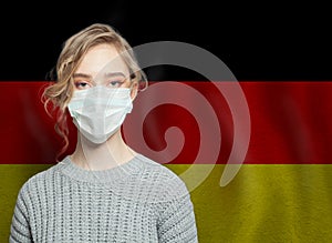 German woman wearing a face mask with flag Germany. Flu epidemic and virus protection concept in  Germany