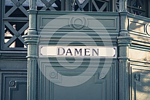 The german word `Damen` women at historic public restroom,