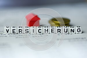 German Word INSURANCE formed by alphabet blocks: VERSICHERUNG photo