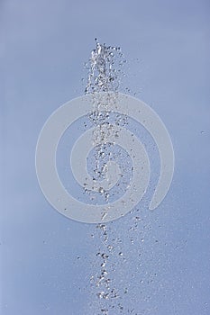 Germany,Bavaria,Schaeftlarn,Fountain splashing against blue sky