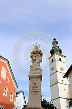 GERMANY, BAVARIA, WAGING AM SEE - SEPTEMBER 22, 2019: Marian column and church St. Martin in Waging am See photo