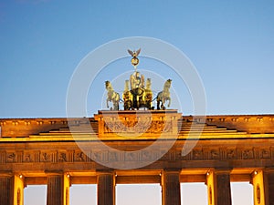 Germany, Berlin, The Brandenburg Gate The Quadriga on top of the gate featuring a chariot drawn by four horses driven b