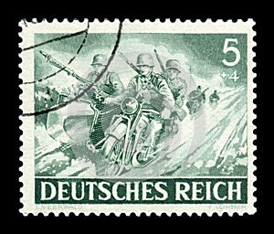 GERMANY - CIRCA 1943: German historical stamp: Military motorcycle units of the Wehrmacht. Motorbike with sidecar with mg-34 machi