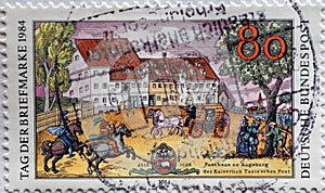 GERMANY - CIRCA 1984  : a postage stamp from Germany, showing a post office of the Kaiserlich Taxis`schen Post in Augsburg. For t