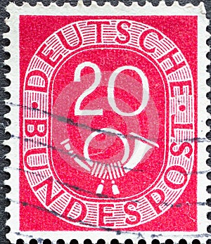 GERMANY - CIRCA 1951: a postage stamp from Germany, showing a sign Deutsche Bundespost with post horn red