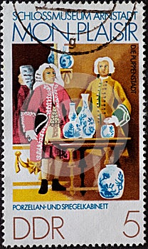 GERMANY, DDR - CIRCA 1974 : a postage stamp from Germany, GDR showing a porcelain and mirror cabinet. Arnstadt Castle Museum, Pupp