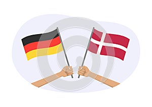 Germany and Denmark flags. Danish and German national symbols. Hand holding waving flag. Vector