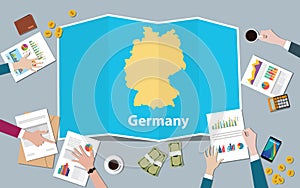 Germany economy country growth nation team discuss with fold maps view from top
