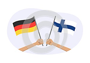 Germany and Finland flags. Finnish and German national symbols. Hand holding waving flag. Vector