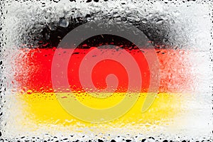 Germany flag. Flag of Germany on the background of water drops. Flag with raindrops. Splashes on glass